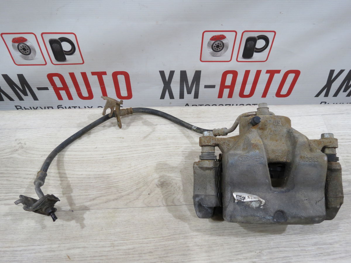 Суппорт тормозной Kia Sportage (QL) IV (2015–2019)